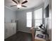 Well-lit office with wood floors, modern desk, white furniture, and ceiling fan at 797 Salerno Circle # C, Myrtle Beach, SC 29579