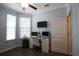 Bright home office featuring a modern desk, printer, chair, and mounted television at 797 Salerno Circle # C, Myrtle Beach, SC 29579