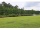 Scenic view of the pond with a fountain, surrounded by lush greenery at 797 Salerno Circle # C, Myrtle Beach, SC 29579