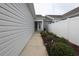 Landscaped side yard with manicured bushes and mulch, complemented by a white fence at 797 Salerno Circle # C, Myrtle Beach, SC 29579