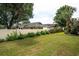 Spacious backyard with a privacy fence, green grass, and well-maintained landscaping at 820 9Th Ave. S, North Myrtle Beach, SC 29582