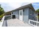 Open air deck with a grill, featuring a door to the home and stairs at 820 9Th Ave. S, North Myrtle Beach, SC 29582