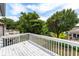 Overlooking deck view with white railing and mature trees at 820 9Th Ave. S, North Myrtle Beach, SC 29582