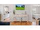 Stylish entryway features a console table and views of the kitchen and bedroom areas at 820 9Th Ave. S, North Myrtle Beach, SC 29582