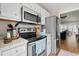 Well-equipped kitchen with stainless steel appliances, white cabinets, and granite countertops at 820 9Th Ave. S, North Myrtle Beach, SC 29582
