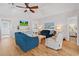 Bright living room featuring vaulted ceiling, ceiling fan, comfortable seating, and hardwood floors at 820 9Th Ave. S, North Myrtle Beach, SC 29582