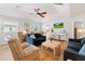 Inviting living room features a ceiling fan, ample seating, wood floors, and a bright, airy atmosphere at 820 9Th Ave. S, North Myrtle Beach, SC 29582
