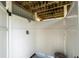 Outdoor shower with white privacy walls and wooden supports, offering a secluded wash area at 820 9Th Ave. S, North Myrtle Beach, SC 29582