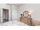 Comfortable bedroom featuring a dresser with mirror, soft lighting, and neutral decor at 857 Farmers Passage Loop, Loris, SC 29569