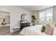 Bright bedroom with large window, dresser, and mirror, offering a cozy and inviting atmosphere at 877 Farmers Passage Loop, Loris, SC 29569