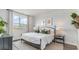 Cozy bedroom featuring a comfortable bed, soft lighting, and a view of the outdoors at 877 Farmers Passage Loop, Loris, SC 29569