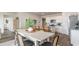 Open-concept dining area with stylish decor that connects the kitchen and living spaces at 877 Farmers Passage Loop, Loris, SC 29569