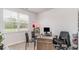 Bright home office features a large window, neutral walls, and functional desk space for productivity at 877 Farmers Passage Loop, Loris, SC 29569
