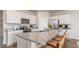 Kitchen with granite countertops, white cabinets, stainless steel appliances, and bar seating at 877 Farmers Passage Loop, Loris, SC 29569