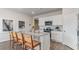 Kitchen with granite countertops, white cabinets, stainless steel appliances, and bar seating at 877 Farmers Passage Loop, Loris, SC 29569