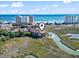 Scenic aerial view showcasing condo's proximity to beaches and ocean, with marshland surrounding the building at 9501 Shore Dr. # A-311, Myrtle Beach, SC 29572