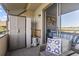Charming balcony with seating area and view into the bedroom at 9501 Shore Dr. # A-311, Myrtle Beach, SC 29572