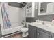 Compact bathroom with shower and tub combo, ample storage, and a clean, modern design at 9501 Shore Dr. # A-311, Myrtle Beach, SC 29572