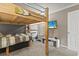 Comfortable bedroom features a raised loft bed, wall-mounted tv, and a clean, organized layout at 9501 Shore Dr. # A-311, Myrtle Beach, SC 29572