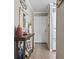 Welcoming hallway featuring decorative table, charming decorations, and interior door access at 9501 Shore Dr. # A-311, Myrtle Beach, SC 29572