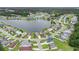 Aerial view of a home nestled in a community with a lake, tennis courts, and a swimming pool at 1001 Greencrest Ct., Conway, SC 29526