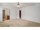 Well-lit bedroom featuring neutral carpet and ceiling fan, with an open closet at 1001 Greencrest Ct., Conway, SC 29526