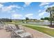 Peaceful view of a community pond with a fountain and lounge chairs in view at 1001 Greencrest Ct., Conway, SC 29526