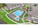 Aerial view of community pool and hot tub, with pergolas, lounge chairs, and well-manicured landscaping at 1001 Greencrest Ct., Conway, SC 29526