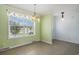 Bright dining area with large window, chandelier, and easy access to additional rooms at 1001 Greencrest Ct., Conway, SC 29526