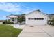 Two-car garage with paneled door and concrete driveway for parking convenience at 1001 Greencrest Ct., Conway, SC 29526