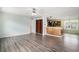 Open living room with hardwood floors, built-in bookshelves, and seamless flow to the kitchen at 1001 Greencrest Ct., Conway, SC 29526