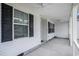 Covered front porch with ceiling fans and views of the front yard at 1001 Greencrest Ct., Conway, SC 29526