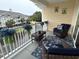 Relax on this private balcony with comfortable seating and scenic view of the pond at 1029 Ray Costin Way # Villa 909, Murrells Inlet, SC 29576