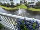 Scenic balcony view overlooking a pond with a beautiful water fountain feature at 1029 Ray Costin Way # Villa 909, Murrells Inlet, SC 29576