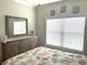 Bedroom with a large window, dresser and mirror featuring a decorative seashell theme at 1029 Ray Costin Way # Villa 909, Murrells Inlet, SC 29576