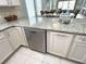 Open kitchen with stainless steel dishwasher and ample granite counter space at 1029 Ray Costin Way # Villa 909, Murrells Inlet, SC 29576