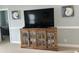 Living room featuring a rustic wood cabinet with glass doors and nautical decorations displayed on a TV console at 1029 Ray Costin Way # Villa 909, Murrells Inlet, SC 29576