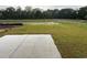 View of backyard with a concrete patio and freshly laid sod at 1064 Oak Meadow Dr., Conway, SC 29526