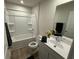 Bright bathroom featuring single vanity, modern fixtures, and a shower-tub combo at 1064 Oak Meadow Dr., Conway, SC 29526