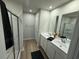 Modern bathroom with double vanity, sleek fixtures, and a glass-enclosed shower at 1064 Oak Meadow Dr., Conway, SC 29526