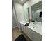 Modern bathroom with double vanity, sleek fixtures, and a glass-enclosed shower at 1064 Oak Meadow Dr., Conway, SC 29526