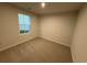 A cozy bedroom with carpeted floors, a window for natural light, and neutral paint at 1064 Oak Meadow Dr., Conway, SC 29526