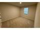A cozy bedroom with carpeted floors, a window for natural light, and neutral paint at 1064 Oak Meadow Dr., Conway, SC 29526