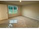 Bedroom with plush carpeting, a window, and a white door at 1064 Oak Meadow Dr., Conway, SC 29526