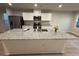 Granite island kitchen featuring a stainless sink, modern appliances, and neutral color palette at 1064 Oak Meadow Dr., Conway, SC 29526