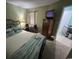 Comfortable bedroom with a full dresser and natural lighting at 1101 Possum Trot Rd. # A202, North Myrtle Beach, SC 29582