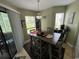 Bright dining area with large windows and an outdoor patio at 1101 Possum Trot Rd. # A202, North Myrtle Beach, SC 29582