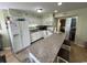 Well-equipped kitchen with a breakfast bar and white cabinetry at 1101 Possum Trot Rd. # A202, North Myrtle Beach, SC 29582