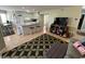 Cozy open-concept living room and kitchen with breakfast bar and modern appliances at 1101 Possum Trot Rd. # A202, North Myrtle Beach, SC 29582