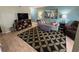 Comfortable living room with stylish furnishings, decorative rug and wall art at 1101 Possum Trot Rd. # A202, North Myrtle Beach, SC 29582